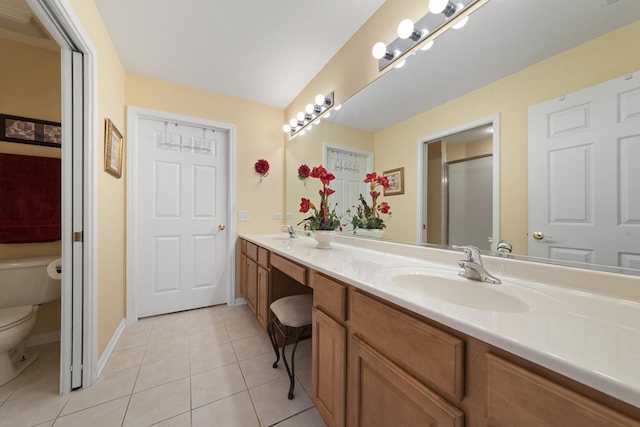 1908 Timbers Edge Cir, Joliet, IL 60431 - full bath featuring toilet, double vanity, tile patterned floors, and baseboards