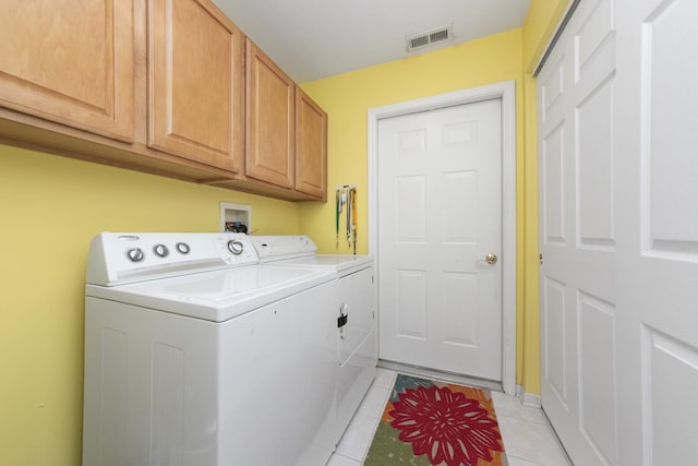1908 Timbers Edge Cir, Joliet, IL 60431 - laundry area with separate washer and dryer, cabinet space, light tile patterned flooring, and baseboards
