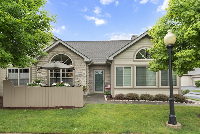 1908 Timbers Edge Cir, Joliet, IL 60431 - view of front of property featuring a shingled roof, stone siding, and a front lawn