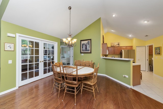 1908 Timbers Edge Cir, Joliet, IL 60431 - dining space featuring french doors, vaulted ceiling, a chandelier, baseboards, and light wood-style flooring