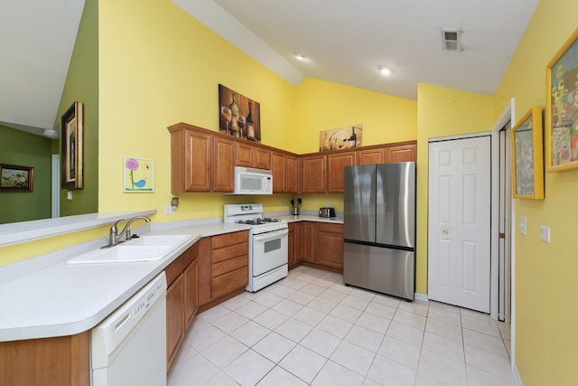 1908 Timbers Edge Cir, Joliet, IL 60431 - kitchen featuring white appliances, a sink, high vaulted ceiling, a peninsula, and light tile patterned flooring