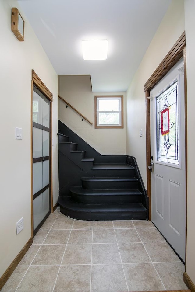 211 N Maple St, Grant Park, IL 60940 - entrance foyer with stairway, light tile patterned flooring, and baseboards