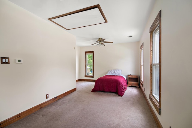211 N Maple St, Grant Park, IL 60940 - carpeted bedroom featuring attic access, baseboards, and ceiling fan