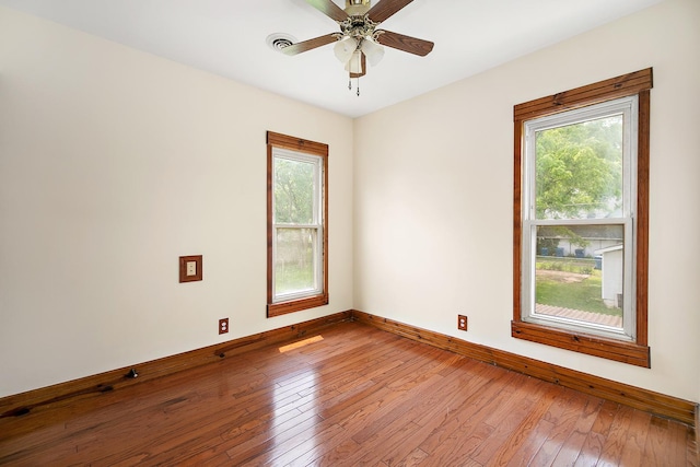211 N Maple St, Grant Park, IL 60940 - spare room with healthy amount of natural light, baseboards, and wood-type flooring
