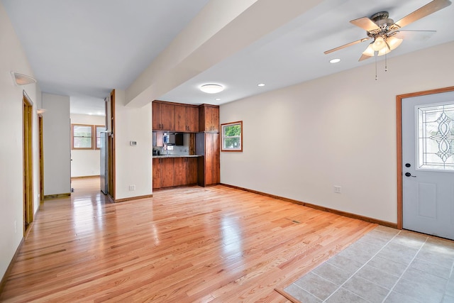 211 N Maple St, Grant Park, IL 60940 - unfurnished living room featuring light wood-style flooring, healthy amount of natural light, ceiling fan, baseboards, and recessed lighting