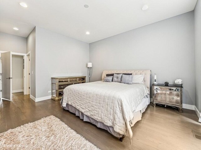 1802 N Mozart St, Chicago, IL 60647 - bedroom with wood finished floors, baseboards, and recessed lighting