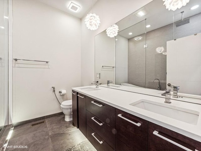 1802 N Mozart St, Chicago, IL 60647 - bathroom featuring toilet, a stall shower, double vanity, tile patterned flooring, and baseboards