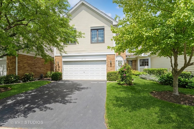 810 Braeman Ct, Libertyville, IL 60048 - view of front of property featuring driveway, a garage, a front lawn, and brick siding