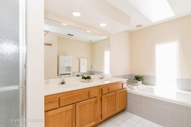 810 Braeman Ct, Libertyville, IL 60048 - bathroom featuring a skylight, tile patterned floors, double vanity, a bath, and recessed lighting