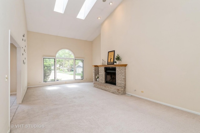 810 Braeman Ct, Libertyville, IL 60048 - unfurnished living room featuring high vaulted ceiling, a skylight, carpet flooring, a fireplace, and recessed lighting