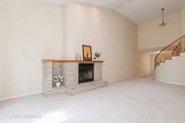 810 Braeman Ct, Libertyville, IL 60048 - unfurnished living room featuring a brick fireplace, carpet floors, stairs, and high vaulted ceiling