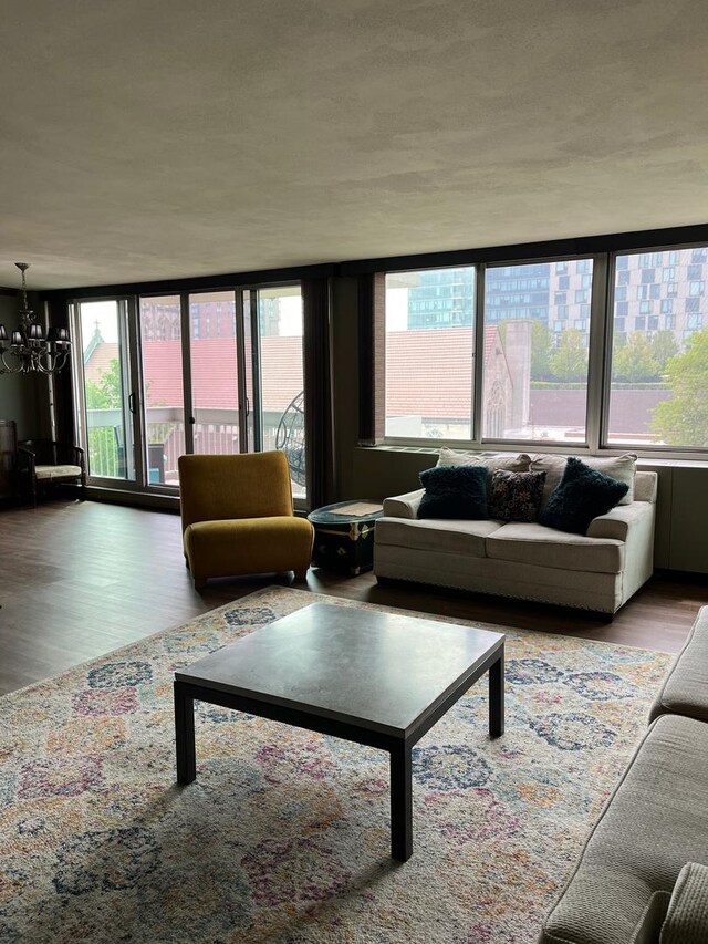 165 N Kenilworth Ave Unit 4D, Oak Park, IL 60301 - living area featuring plenty of natural light, a chandelier, and wood finished floors