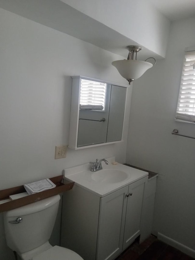310 New Salem St, Park Forest, IL 60466 - half bath featuring vanity, toilet, and healthy amount of natural light