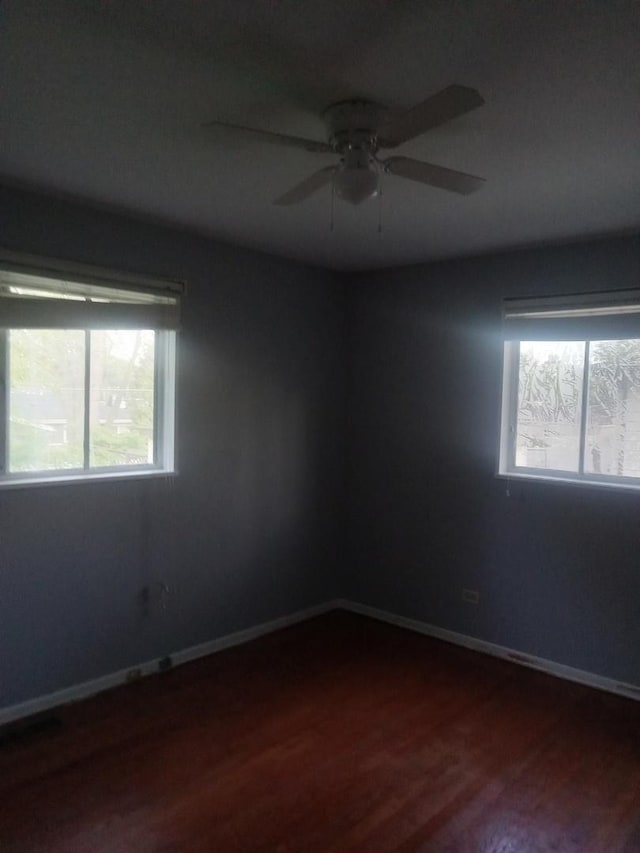 310 New Salem St, Park Forest, IL 60466 - unfurnished room with dark wood-style flooring, a ceiling fan, and baseboards