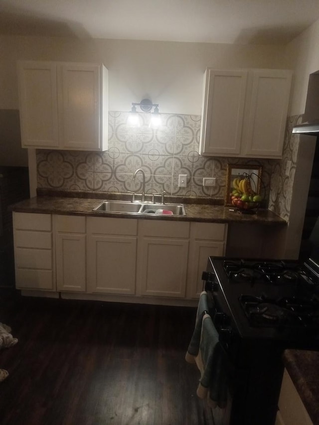 310 New Salem St, Park Forest, IL 60466 - kitchen with a sink, black gas range, decorative backsplash, white cabinets, and dark wood finished floors