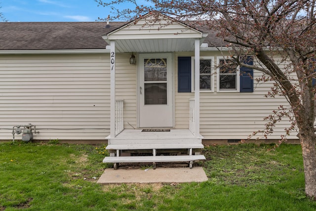 201 S 1st St, Tolono, IL 61880 - entrance to property with roof with shingles, a lawn, and crawl space