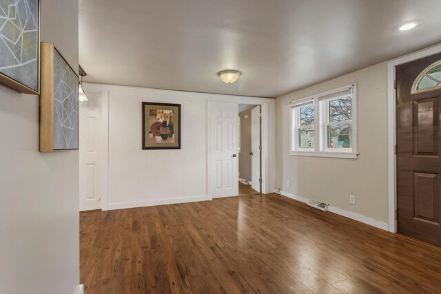 201 S 1st St, Tolono, IL 61880 - foyer entrance featuring wood finished floors and baseboards