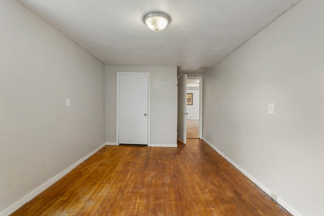 201 S 1st St, Tolono, IL 61880 - empty room with hardwood / wood-style flooring and baseboards