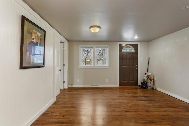 201 S 1st St, Tolono, IL 61880 - foyer featuring wood finished floors and baseboards