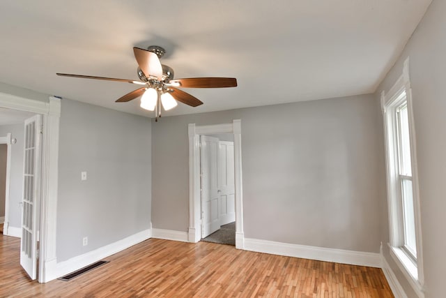 417 E Vermillion St, Odell, IL 60460 - empty room with light wood finished floors, baseboards, healthy amount of natural light, and a ceiling fan
