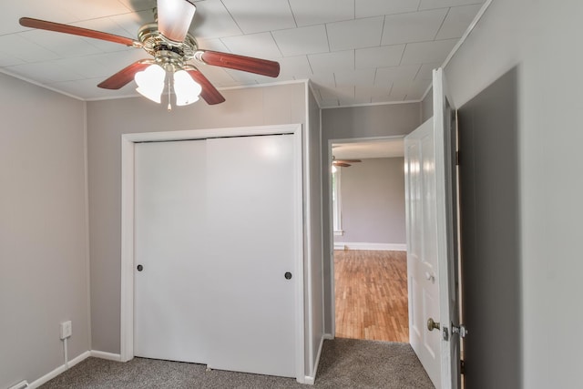 417 E Vermillion St, Odell, IL 60460 - unfurnished bedroom with ornamental molding, carpet, a closet, baseboards, and a ceiling fan