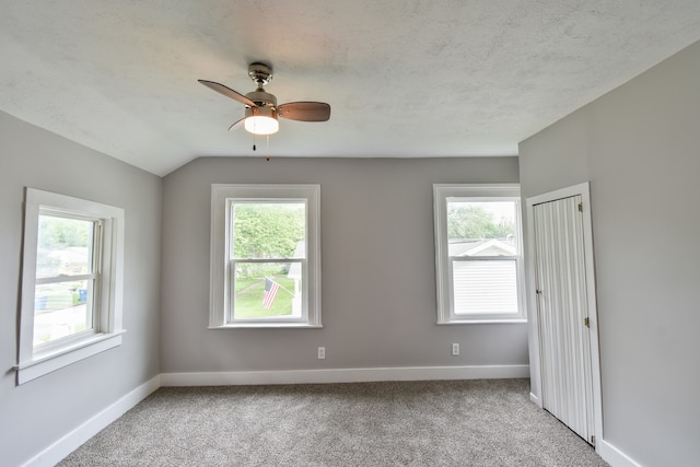 417 E Vermillion St, Odell, IL 60460 - carpeted spare room with ceiling fan, baseboards, and lofted ceiling
