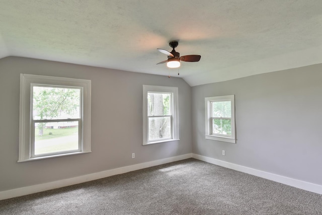 417 E Vermillion St, Odell, IL 60460 - empty room with lofted ceiling, a ceiling fan, carpet floors, and baseboards