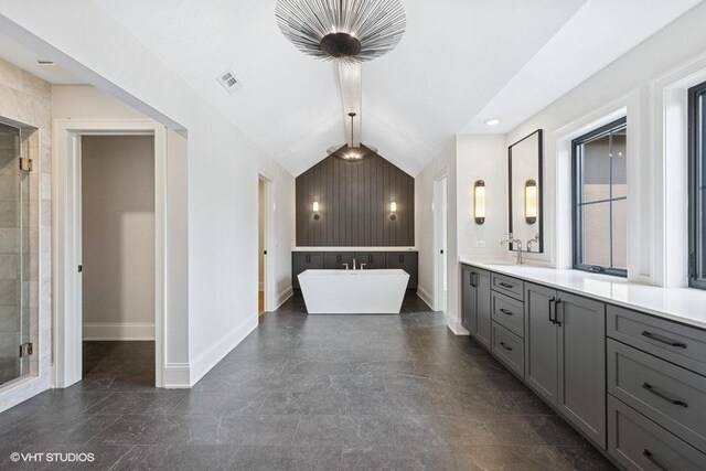 5906 Juniper Ct, Western Springs, IL 60558 - full bathroom featuring baseboards, a freestanding bath, double vanity, lofted ceiling, and a shower stall