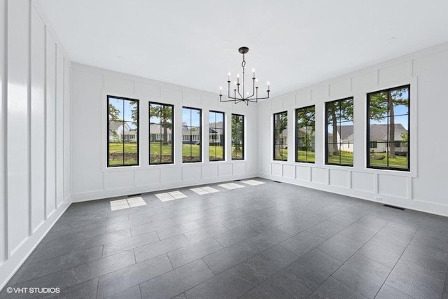 5906 Juniper Ct, Western Springs, IL 60558 - unfurnished room featuring a decorative wall, healthy amount of natural light, and a chandelier