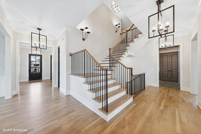 5906 Juniper Ct, Western Springs, IL 60558 - entryway with a chandelier, stairs, wood finished floors, and crown molding