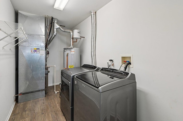 3736 Munson St, Plano, IL 60545 - laundry room with separate washer and dryer, wood finished floors, water heater, and heating unit