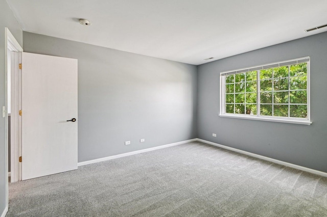 3736 Munson St, Plano, IL 60545 - carpeted empty room with a smoke detector and baseboards