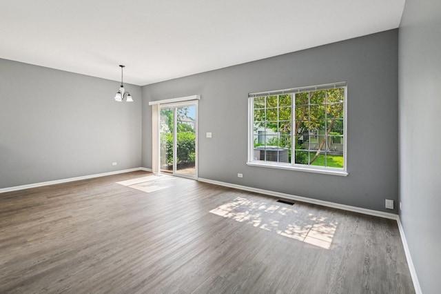 3736 Munson St, Plano, IL 60545 - spare room with wood finished floors and a chandelier