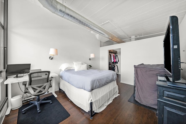 1530 S State St Unit 722, Chicago, IL 60605 - bedroom featuring a walk in closet, wood finished floors, a closet, and a desk