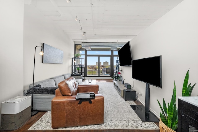 1530 S State St Unit 722, Chicago, IL 60605 - living room with wood finished floors, rail lighting, and a wall of windows