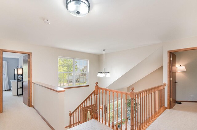 2519 Quail Cv, Carpentersville, IL 60110 - hallway with light colored carpet and an upstairs landing