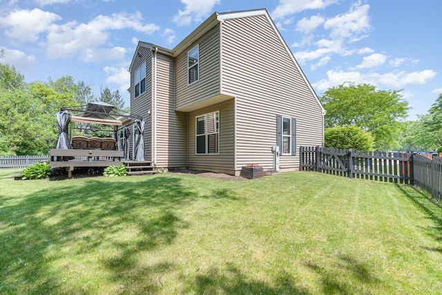 2519 Quail Cv, Carpentersville, IL 60110 - back of property with a gazebo, a deck, and a fenced backyard