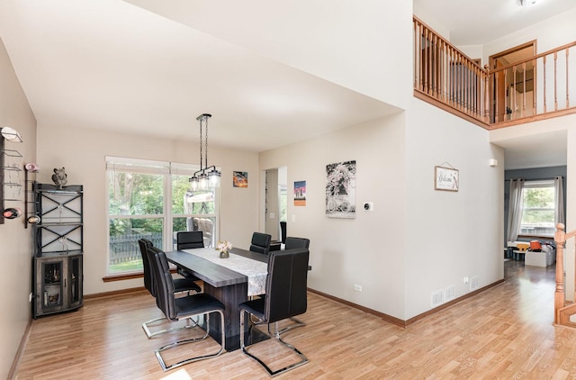 2519 Quail Cv, Carpentersville, IL 60110 - dining space featuring light wood-style flooring and a chandelier