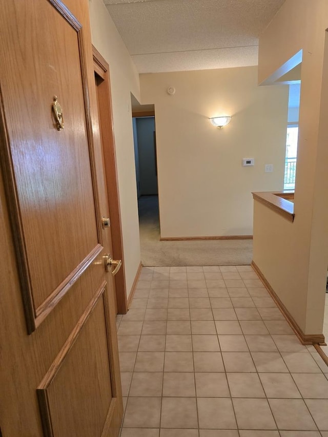 455 W Front St Unit 307, Wheaton, IL 60187 - hall featuring a textured ceiling and baseboards