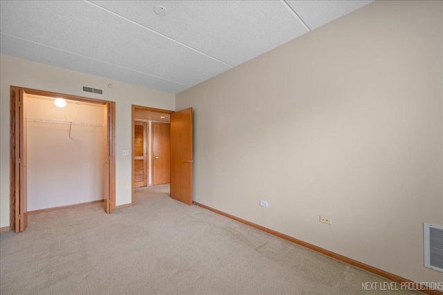 455 W Front St Unit 307, Wheaton, IL 60187 - unfurnished bedroom featuring a closet and light carpet