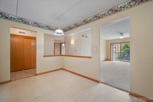 455 W Front St Unit 307, Wheaton, IL 60187 - unfurnished dining area featuring ceiling fan, tile patterned floors, and a textured ceiling