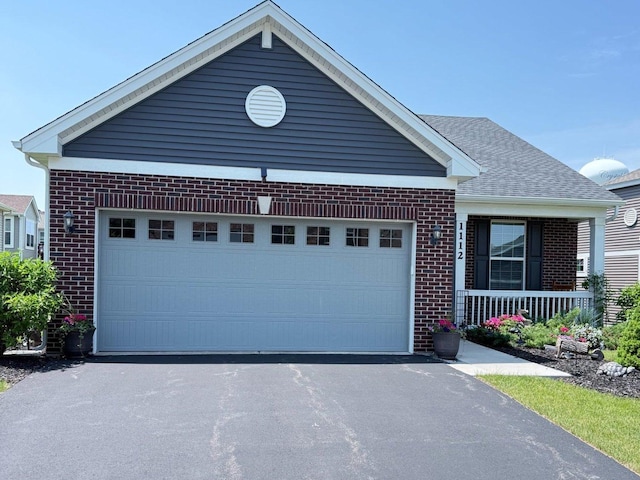 1112 Black Cherry Dr, Crystal Lake, IL 60012 - single story home featuring brick siding, asphalt driveway, a porch, and a garage