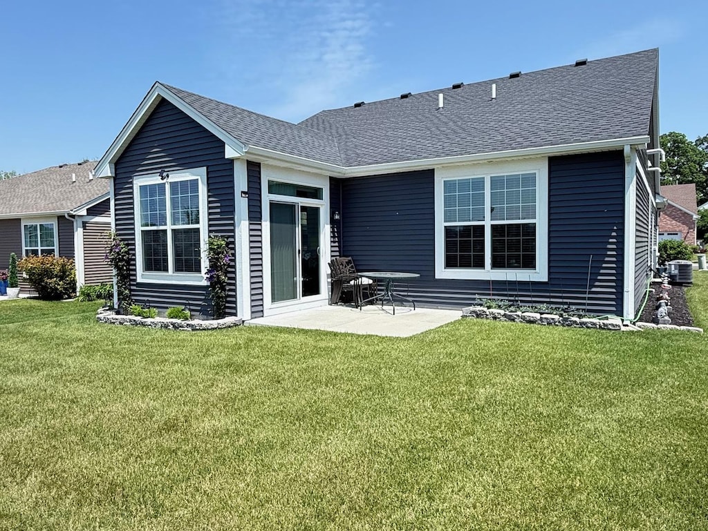 1112 Black Cherry Dr, Crystal Lake, IL 60012 - rear view of house with central AC, a lawn, a patio area, and roof with shingles