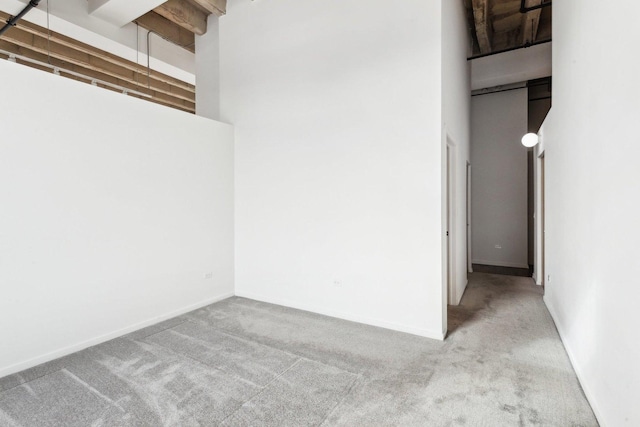 1645 W Ogden Ave Unit 516, Chicago, IL 60612 - unfurnished room with carpet floors, a high ceiling, and baseboards
