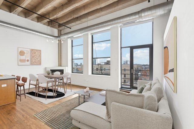 1645 W Ogden Ave Unit 516, Chicago, IL 60612 - living area featuring wood finished floors