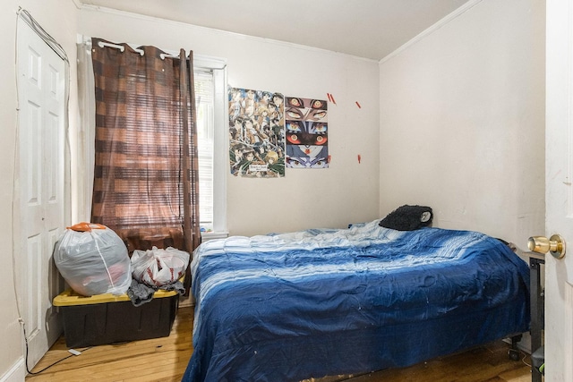 8011 S Ada St, Chicago, IL 60620 - bedroom featuring ornamental molding, wood finished floors, and multiple windows