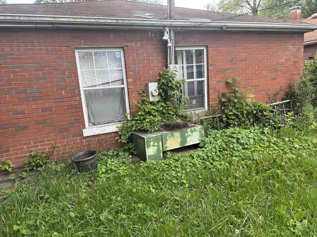 14915 Irving Ave, Dolton, IL 60419 - view of side of home with brick siding and a shingled roof