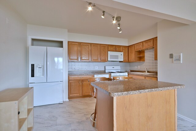 7321 W Fullerton Ave Unit 10, Elmwood Park, IL 60707 - kitchen featuring white appliances, light marble finish floors, a kitchen island, and tasteful backsplash
