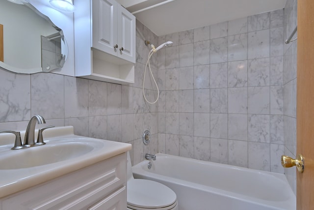 7321 W Fullerton Ave Unit 10, Elmwood Park, IL 60707 - bathroom featuring toilet, bathtub / shower combination, vanity, tile walls, and tasteful backsplash