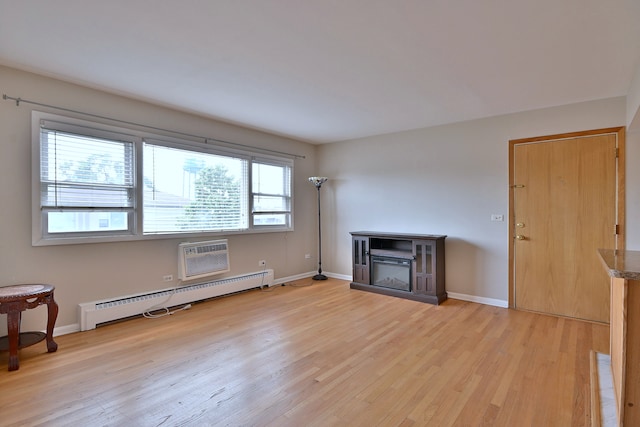 7321 W Fullerton Ave Unit 10, Elmwood Park, IL 60707 - unfurnished living room with a baseboard heating unit, light wood-style floors, a glass covered fireplace, and baseboards
